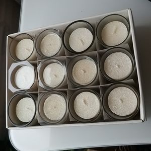 Set of 12 Votive shimmering Candles w/glass holder all new.